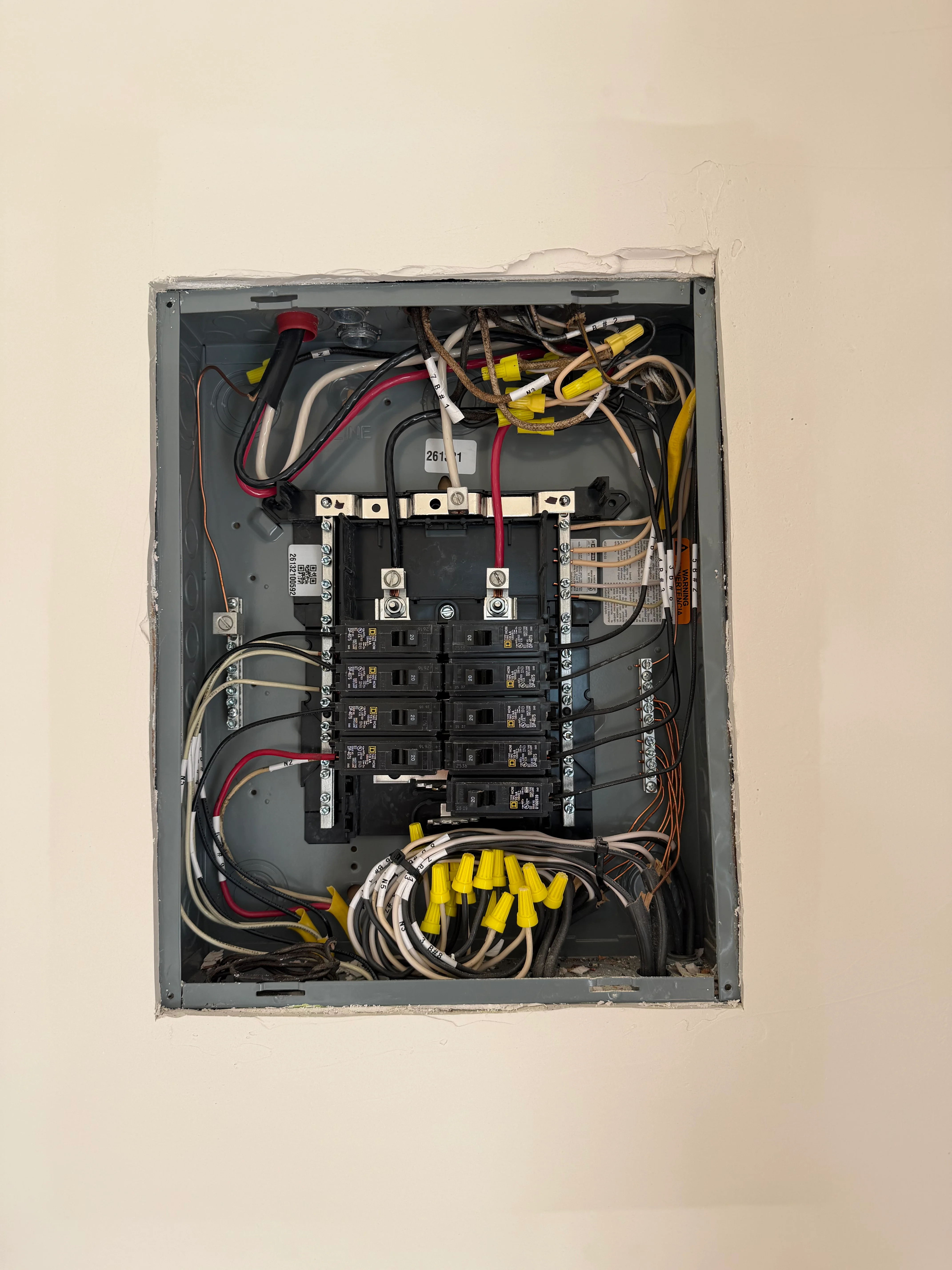 Interior view of newly installed 200-amp electrical subpanel with organized wiring and breakers