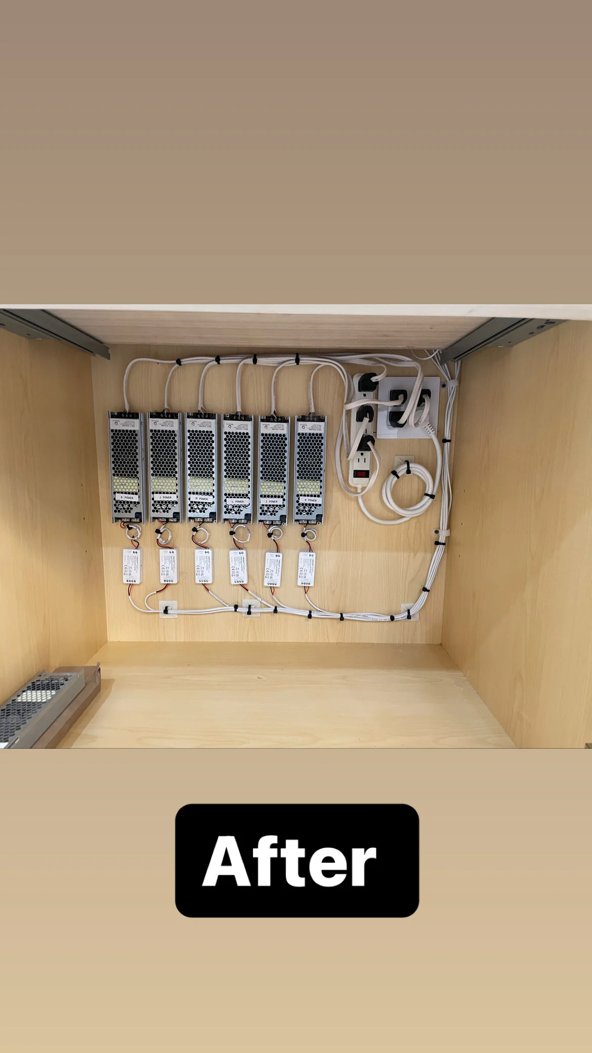 Six power distribution units with organized white cables and labeled power supplies in wooden cabinet